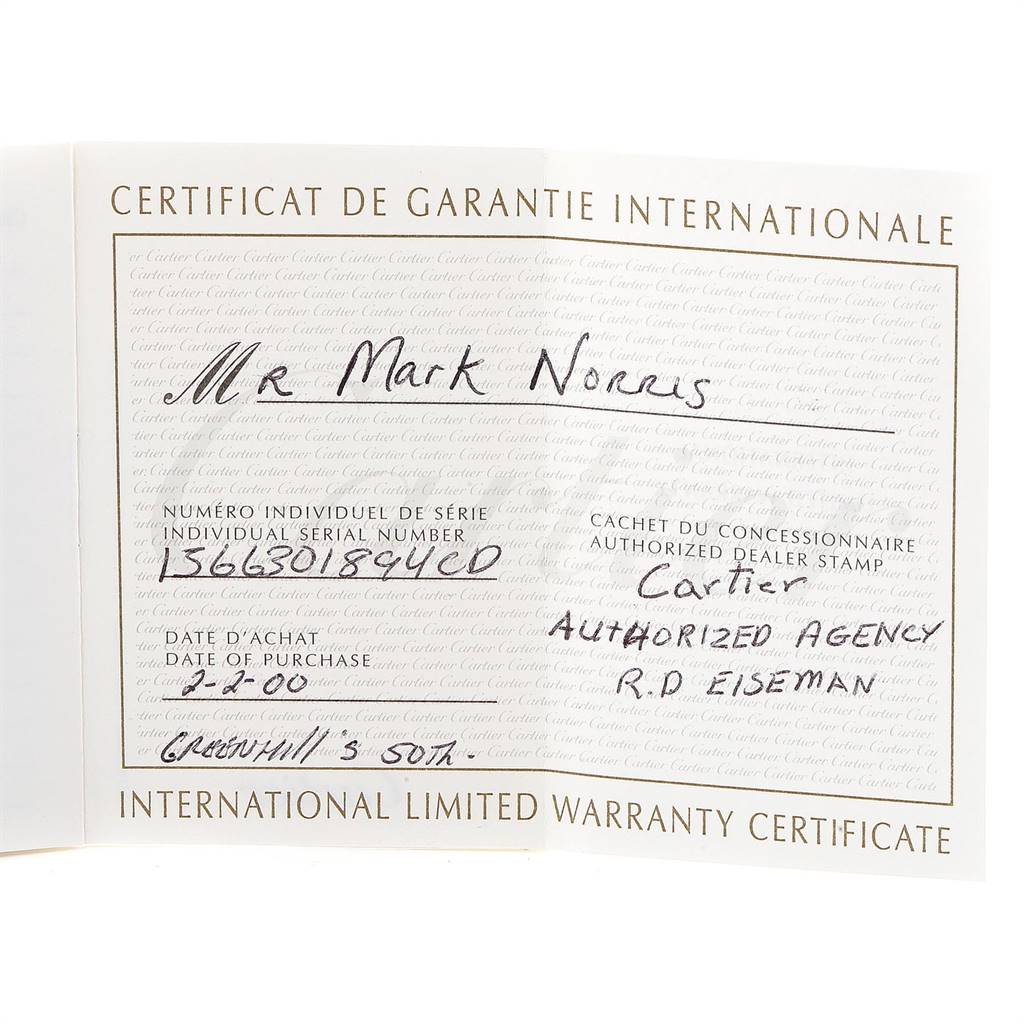 The image shows an international limited warranty certificate for a Cartier Santos W20011C4 Stainless Steel Silver Dial W20011C4 Stainless Steel Silver Dial model watch.