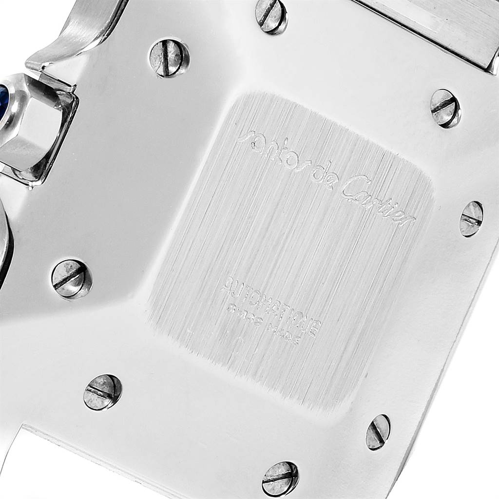 This image shows the back of a Santos model watch by Cartier, including the case back with visible screws and engravings.