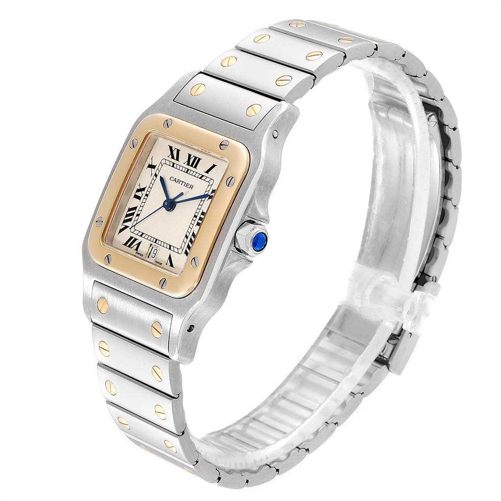 The Cartier Santos 187901 Stainless Steel Silver Dial 187901 Stainless Steel Silver Dial watch is shown at a slight angle, displaying its face, bezel, bracelet, and crown with a blue cabochon.