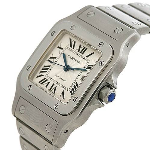 The image shows a Santos model watch by Cartier from an angled side view, highlighting the face, bezel, crown, and part of the bracelet.