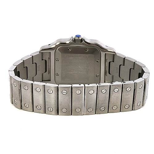 The image shows the back view of a Santos model by Cartier, highlighting the metal bracelet and case back.