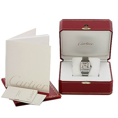 The image shows a Cartier Santos Stainless Steel Silver Dial Stainless Steel Silver Dial model watch in its open red box, accompanied by a booklet and additional documents.