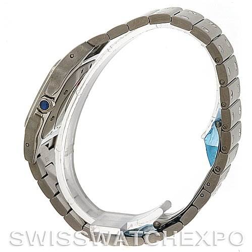 The image shows a side angle of the Cartier Santos W20055D6 Men
s Stainless Steel Silver Dial W20055D6 Men
s Stainless Steel Silver Dial watch, focusing on its metal bracelet and crown with a blue cabochon.