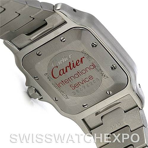 The image shows the back case and part of the bracelet of a Cartier Santos W20058C4 Men's Stainless Steel Silver Dial W20058C4 Men's Stainless Steel Silver Dial watch, featuring an "International Service" engraving.