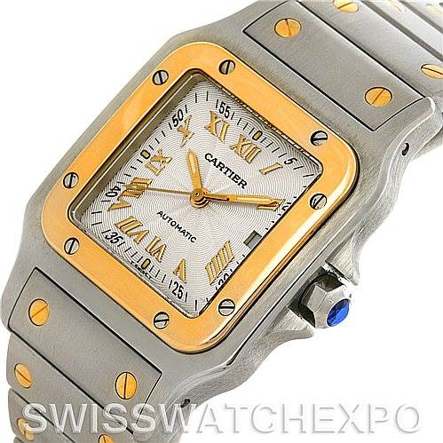 The image shows a close-up angled view of a Cartier Santos W20058C4 Men's Stainless Steel Silver Dial W20058C4 Men's Stainless Steel Silver Dial watch, featuring its face, bezel, and part of the bracelet.