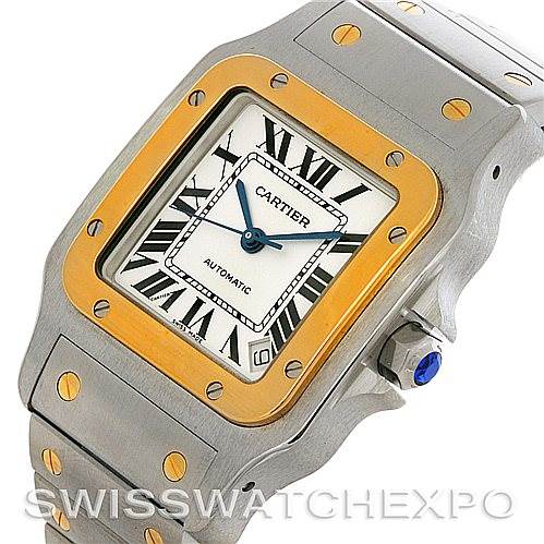 This image shows a close-up angled view of the Cartier Santos W20099C4 Men
s Stainless Steel Silver Dial W20099C4 Men
s Stainless Steel Silver Dial watch, highlighting the face, bezel, bracelet, and screws.