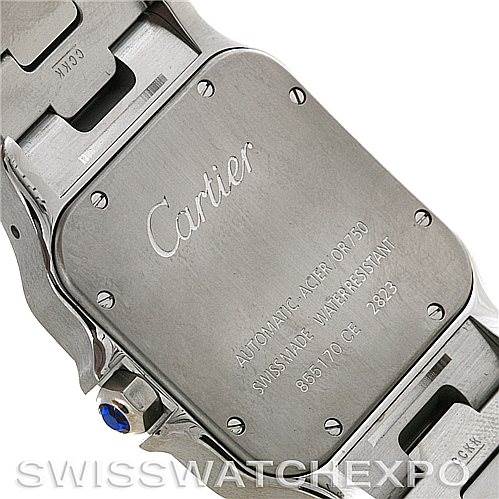 The image shows the case back of the Cartier Santos W20099C4 Men
s Stainless Steel Silver Dial W20099C4 Men
s Stainless Steel Silver Dial watch, highlighting its engraved specifications and part of the metal bracelet.