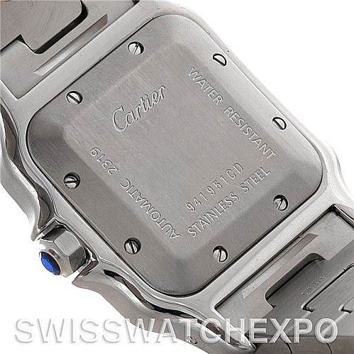 The image shows the back case of a Cartier Santos W20055D6 Men
s Stainless Steel Silver Dial W20055D6 Men
s Stainless Steel Silver Dial watch, including the brand name, model details, and water resistance information.