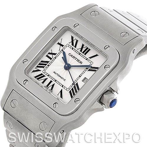 This image shows a close-up of the dial, bezel, and part of the bracelet of a Santos model watch by Cartier.