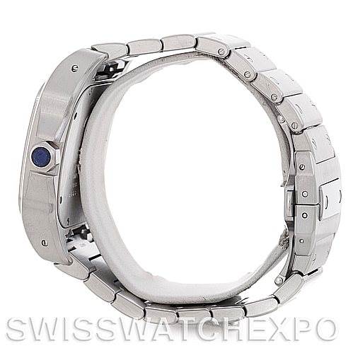 The Cartier Santos W200737G Men
s Stainless Steel Silver Dial W200737G Men
s Stainless Steel Silver Dial watch is shown from a side angle, highlighting its blue cabochon crown, case, and metal bracelet.