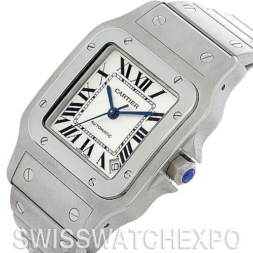 The image shows a close-up front view of the Santos model by Cartier, highlighting the watch face, bezel, and part of the bracelet.