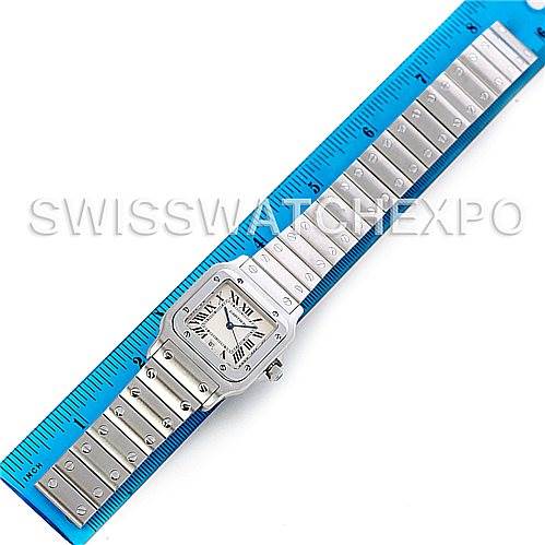 This image shows the Cartier Santos W20060D6 Men
s Stainless Steel Silver Dial W20060D6 Men
s Stainless Steel Silver Dial watch from a top-down angle, displaying the full face and strap alongside a ruler for scale.