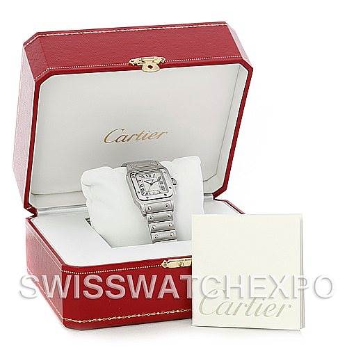 The image shows a Cartier Santos W20060D6 Men
s Stainless Steel Silver Dial W20060D6 Men
s Stainless Steel Silver Dial watch in a red Cartier box, accompanied by a Cartier booklet.