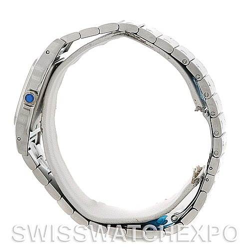 The image shows a side view of a Cartier Santos W20060D6 Men
s Stainless Steel Silver Dial W20060D6 Men
s Stainless Steel Silver Dial watch, highlighting the bracelet, bezel, and crown with a blue cabochon.