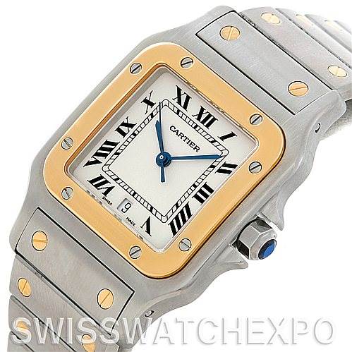 The image shows a Cartier Santos W20011C4 Men
s Stainless Steel Silver Dial W20011C4 Men
s Stainless Steel Silver Dial watch in an angled view, highlighting the face, bezel, crown, and part of the bracelet.