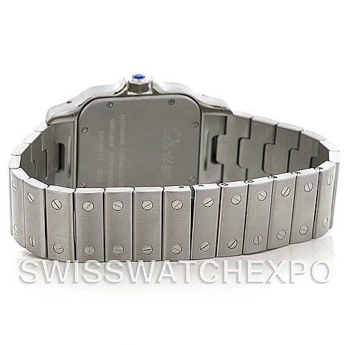 The photo shows the back of a Santos model by Cartier, highlighting the stainless steel case back and bracelet.