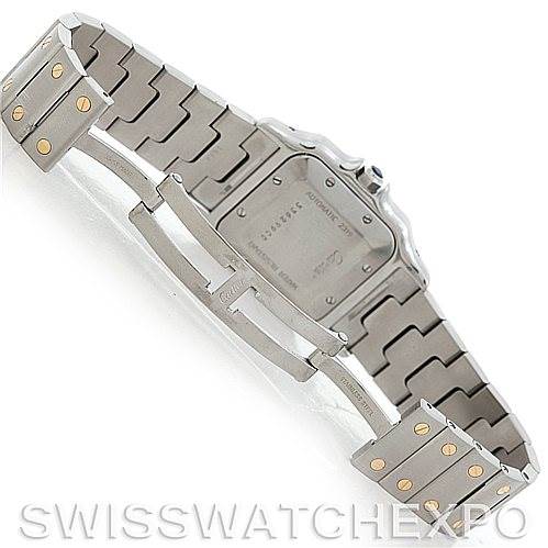 The image shows the backside of a Santos model by Cartier, focusing on the metal bracelet and the clasp.