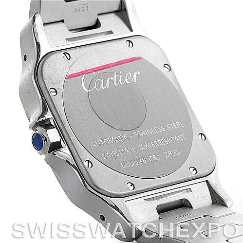 The image shows the back casing of a Cartier Santos W20098D6 Men
s Stainless Steel Silver Dial W20098D6 Men
s Stainless Steel Silver Dial model watch displaying its engravings and screws, plus a part of the bracelet.