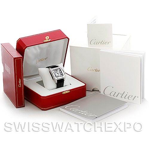 The image shows a Cartier Santos W20073X8 Men's Stainless Steel Silver Dial W20073X8 Men's Stainless Steel Silver Dial watch in its red case with accompanying booklets and packaging, viewed from an angled overhead perspective.