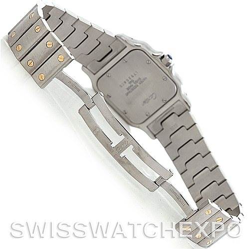 The image shows the backside and bracelet of a Santos model by Cartier in a partially open position.