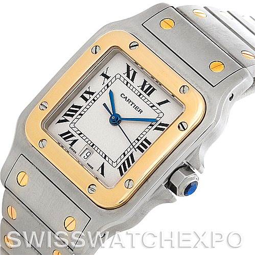 This image displays a Cartier Santos W20011C4 Men's Stainless Steel Silver Dial W20011C4 Men's Stainless Steel Silver Dial watch from a diagonal angle, showcasing the face, bezel, and part of the bracelet.