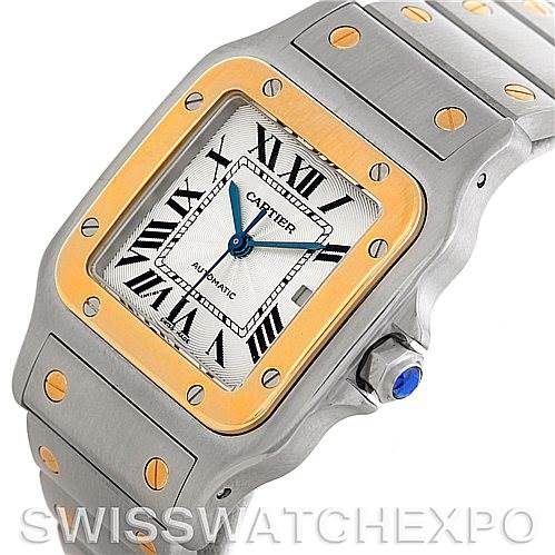 This image shows a Cartier Santos W20058C4 Men
s Stainless Steel Silver Dial W20058C4 Men
s Stainless Steel Silver Dial watch from an angled perspective, highlighting its face, bezel, and partially visible strap.