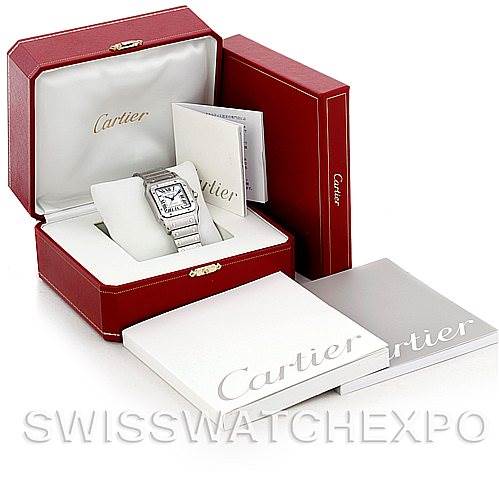 The image shows a Cartier Santos W20098D6 Men
s Stainless Steel Silver Dial W20098D6 Men
s Stainless Steel Silver Dial model watch placed in its open red box along with additional Cartier branded booklets and packaging.