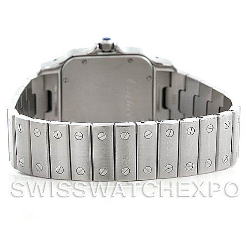 The image shows the back of a Santos model watch by Cartier, focusing on the stainless steel bracelet and case back.