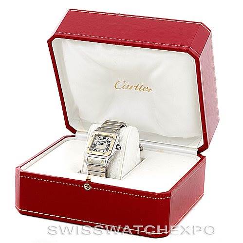 The Cartier Santos W20011C4 Men
s Stainless Steel Silver Dial W20011C4 Men
s Stainless Steel Silver Dial watch is displayed at an angle inside an open, red Cartier box.