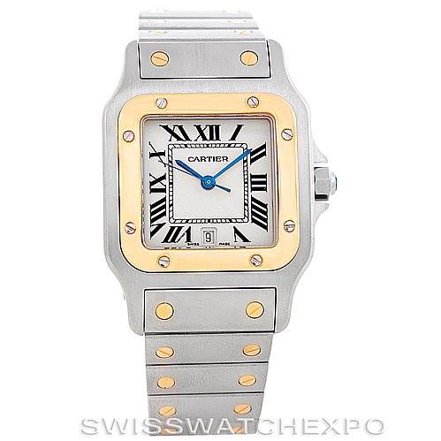The image shows a frontal view of the Cartier Santos W20011C4 Men
s Stainless Steel Silver Dial W20011C4 Men
s Stainless Steel Silver Dial watch, highlighting its square face, gold bezel, and metal bracelet with gold screws.