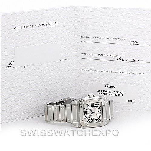 The Cartier Santos W200737G Men's Stainless Steel Silver Dial W200737G Men's Stainless Steel Silver Dial watch is shown from an angled front view, alongside its certificate and warranty card.