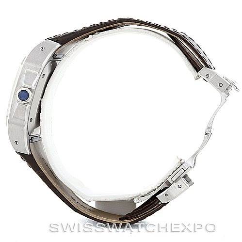 This image shows a side profile of a Cartier Santos W20106X8 Men
s Stainless Steel Silver Dial W20106X8 Men
s Stainless Steel Silver Dial watch, highlighting the crown with a blue cabochon and a leather strap.