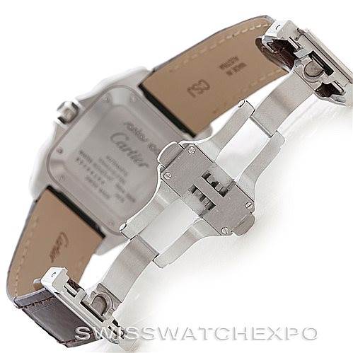 The image shows the back of a Cartier Santos W20106X8 Men
s Stainless Steel Silver Dial W20106X8 Men
s Stainless Steel Silver Dial watch, highlighting its clasp and part of the leather strap.