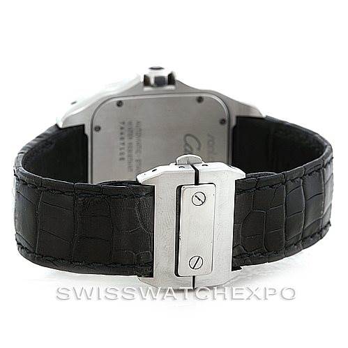 The image shows the backside of the Cartier Santos W20073X8 Stainless Steel Silver Dial W20073X8 Stainless Steel Silver Dial watch, highlighting its clasp and black leather strap.