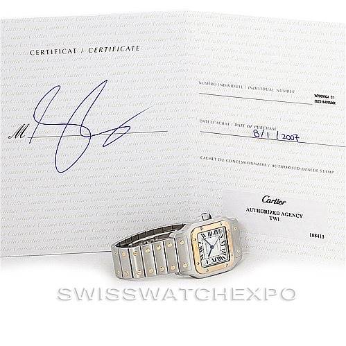 This image shows the Santos model by Cartier from an angled view, along with its certificate and paperwork.