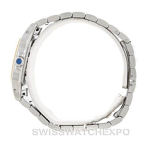 The image shows a Cartier Santos W20011C4 Men
s Stainless Steel Silver Dial W20011C4 Men
s Stainless Steel Silver Dial watch from a side angle, highlighting the case, bracelet, and crown with a blue gemstone.