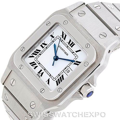 The image shows a close-up angle of a Cartier Santos Men
s Stainless Steel White Dial Men
s Stainless Steel White Dial watch, highlighting the face, crown, and part of the bracelet.