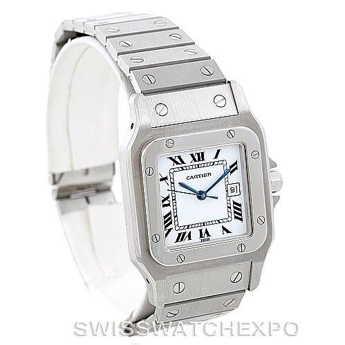 The image shows a Cartier Santos Men
s Stainless Steel White Dial Men
s Stainless Steel White Dial watch from an angled view, displaying the face, bezel, and part of the bracelet.
