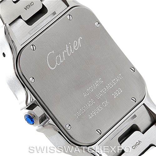 The image shows the back case and part of the bracelet of a Cartier Santos W20099C4 Men's Stainless Steel Silver Dial W20099C4 Men's Stainless Steel Silver Dial watch, highlighting the brand engraving and model details.