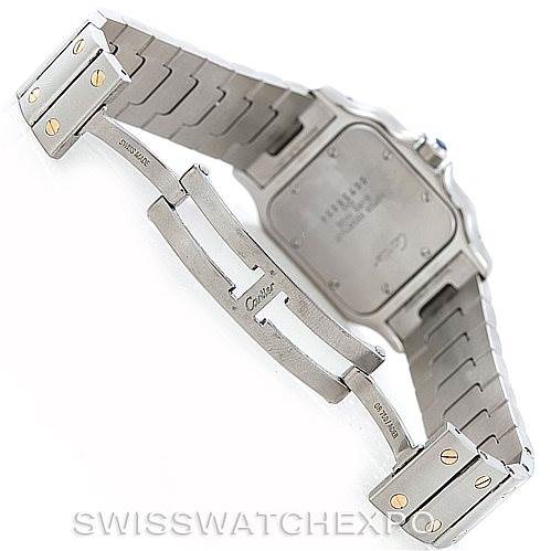 The image shows the back of a Cartier Santos W20011C4 Men
s Stainless Steel Silver Dial W20011C4 Men
s Stainless Steel Silver Dial model watch, focusing on the clasp and a portion of the metal bracelet and caseback.