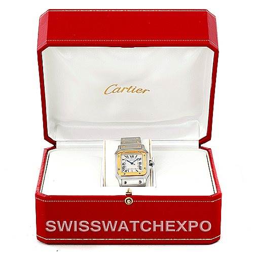 The image shows a Cartier Santos W20011C4 Men
s Stainless Steel Silver Dial W20011C4 Men
s Stainless Steel Silver Dial watch in its red Cartier box, featuring the face and part of the strap.