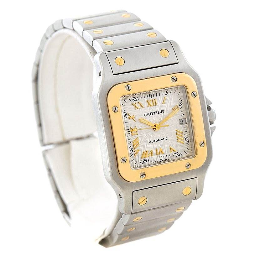 The Cartier Santos W20058C4 Men
s Stainless Steel Silver Dial W20058C4 Men
s Stainless Steel Silver Dial watch is shown at a three-quarter angle, highlighting the face, bezel, and part of the band.