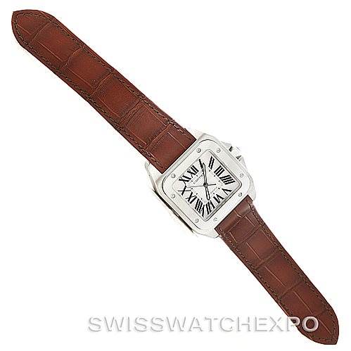 The image shows a top-down view of a Cartier Santos W20073X8 Men
s Stainless Steel Silver Dial W20073X8 Men
s Stainless Steel Silver Dial watch with a brown leather strap and square silver case.