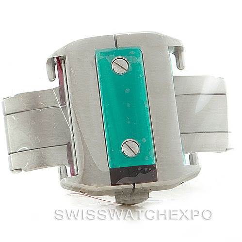 The image shows a side view of a part of a Cartier Santos W20073X8 Men
s Stainless Steel Silver Dial W20073X8 Men
s Stainless Steel Silver Dial watch, specifically the clasp with visible screws and protective film.