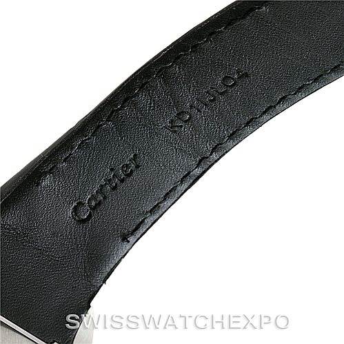 The image shows a close-up of the leather strap of a Cartier Santos W20090X8 Men
s Stainless Steel Silver Dial W20090X8 Men
s Stainless Steel Silver Dial watch, featuring the engraved brand name.