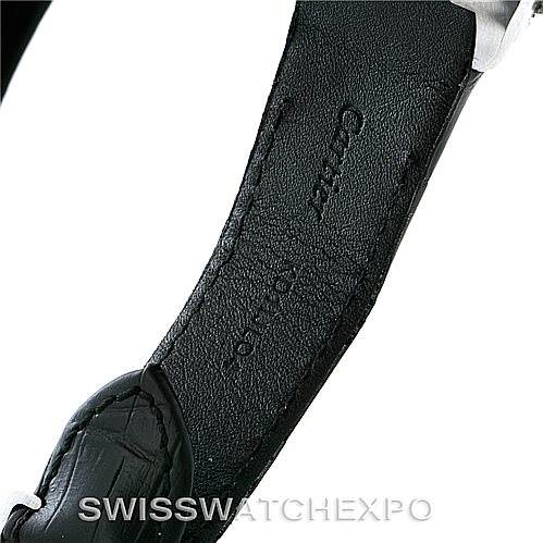 The image shows a close-up of the leather strap of a Santos model by Cartier, highlighting the strap
s interior and engravings.