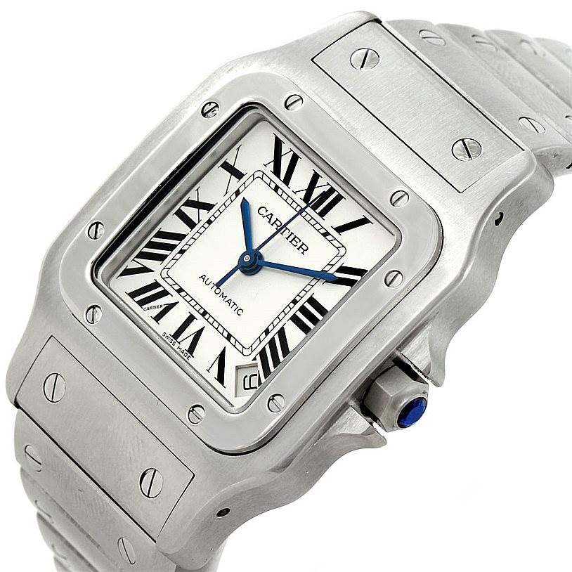 The image shows a Cartier Santos W20098D6 Men's Stainless Steel Silver Dial W20098D6 Men's Stainless Steel Silver Dial watch from an oblique angle, highlighting the dial, bezel, crown, and part of the strap.