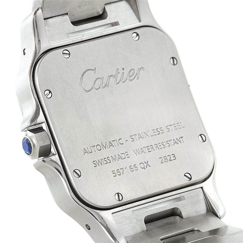 The image shows the back case of a Santos model watch by Cartier, highlighting its screws, brand engraving, and specifications.