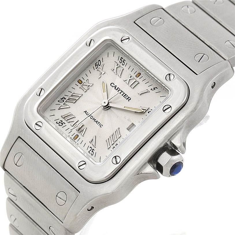 The image shows a Cartier Santos W20055D6 Men's Stainless Steel Silver Dial W20055D6 Men's Stainless Steel Silver Dial watch at an angled top view, highlighting the face, bezel, and part of the bracelet.