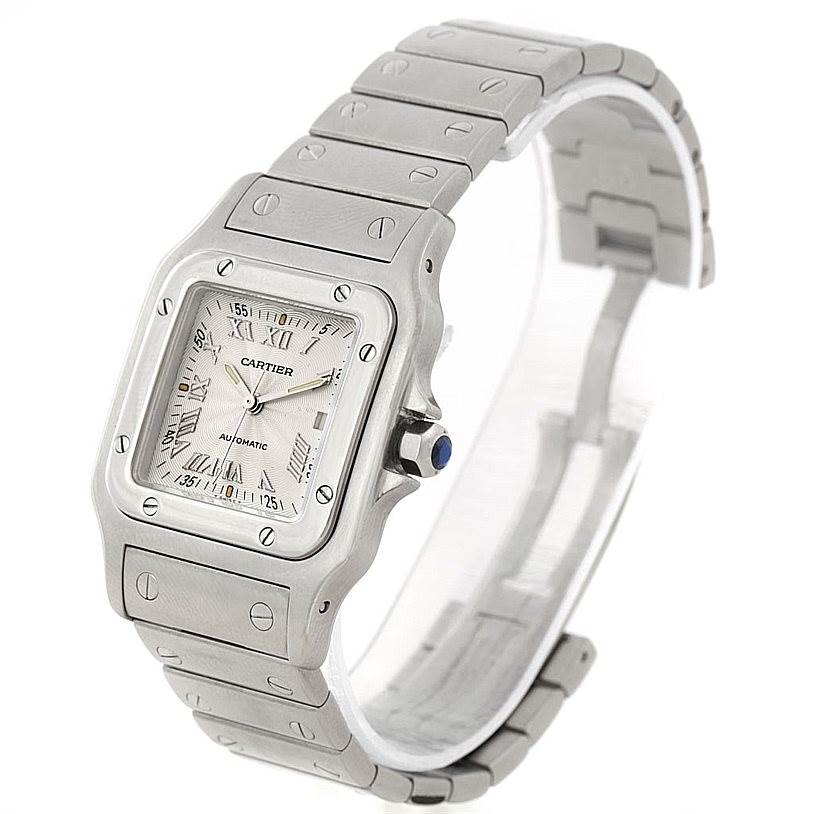 This Cartier Santos W20055D6 Men's Stainless Steel Silver Dial W20055D6 Men's Stainless Steel Silver Dial watch is shown from a front diagonal angle, displaying its face, crown, and bracelet.